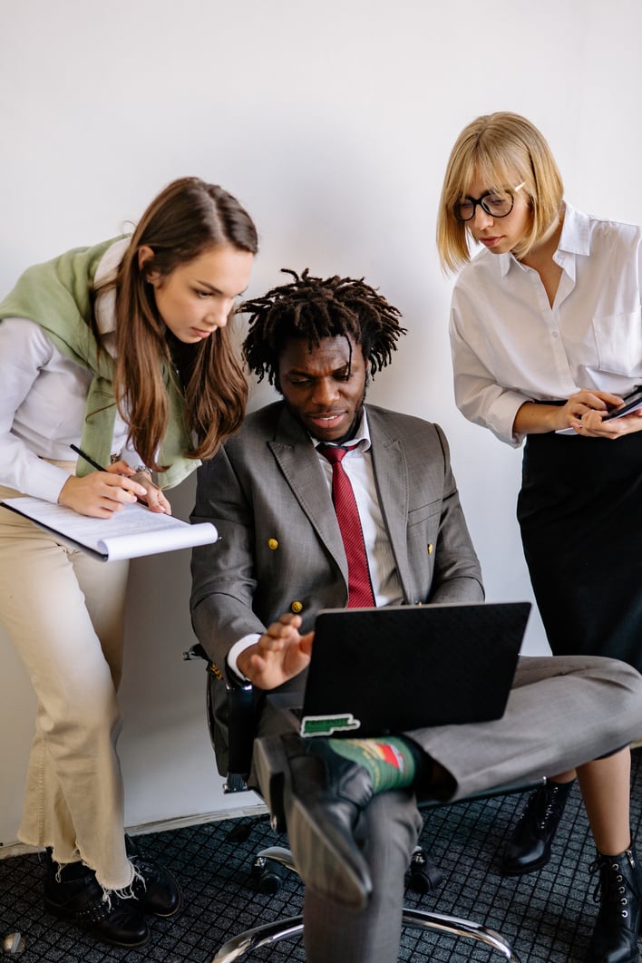 Colleagues Looking at a Laptop